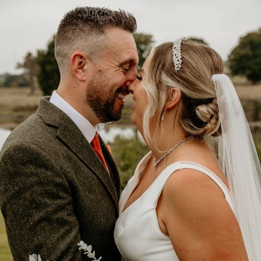 Bridge and Groom lovingly embracing